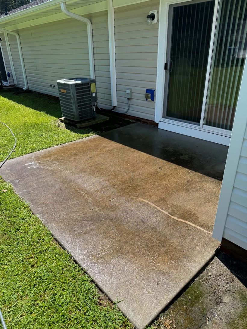 Concrete patio before pressure washing