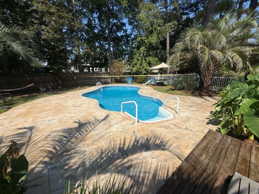 Pool deck stamped concrete cleaned